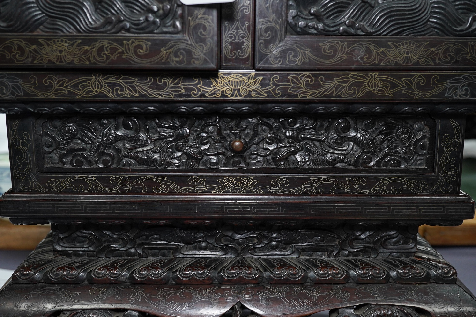 An important pair of Chinese carved zitan and silver wire inlaid ‘cloud and dragon’ curio cabinets and stands, duobaoge, probably Imperial, late Qing dynasty